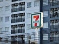 7-Eleven Sign Board Against Building Background