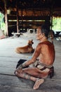 Tribal elder and shaman presenting his protective tattoos which accordi