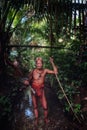 Tribal hunter Toikot on a hunting trip for monkeys in the middle of a s