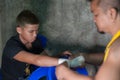 Muay thai fighter swathing hand in boxing bandage