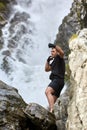 Muay thai fighter training by the waterfall