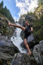 Muay thai fighter training by the waterfall