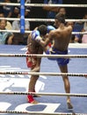 Muay Thai fighters compete in a Thai boxing match