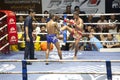 Muay Thai fighters compete in a Thai boxing match