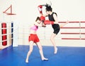 Muay thai woman fighting at boxing ring