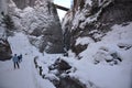 skiers descend into the narrow canyon Royalty Free Stock Photo