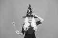 This is so much fun. small child witch hat. trick or treat. supernatural charmer. kid enchantress wave magic wand. happy Royalty Free Stock Photo