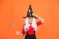 This is so much fun. small child witch hat. trick or treat. supernatural charmer. kid enchantress wave magic wand. happy Royalty Free Stock Photo