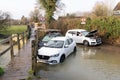 Recovery truck prepares to tow away stranded flooded vehicles in Much Hadham. UK