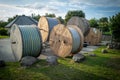 much large reels with fiber optic cables stand on a square Royalty Free Stock Photo