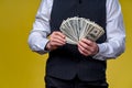 Much money in hands. Dollars in hands. Man holds dollar piles of dollars bills. Royalty Free Stock Photo