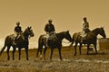 Cowboys heded to a roundup and branding sepia Royalty Free Stock Photo