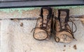 Muddy hiking boots on porch