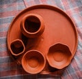 Mud crockery in blurred background