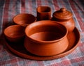 Mud crockery in blurred background