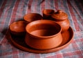 Mud crockery in blurred background