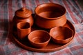 Mud crockery in blurred background