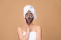 Mud facial mask, face clay mask spa. Beautiful woman with cosmetic mud facial procedure, spa health concept. Skin care Royalty Free Stock Photo