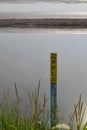 Mud level meter in the Lapindo hot mudflow "Lumpur Lapindo", area in Porong district, Sidoarjo Royalty Free Stock Photo