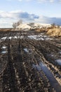 Mud and puddles on the dirt road Royalty Free Stock Photo