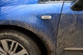 Mud splashes on the side of blue car Royalty Free Stock Photo