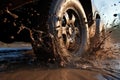 mud splashing from tires of a 4x4 vehicle off-roading Royalty Free Stock Photo