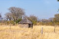 Mud straw and wooden hut with thatched roof in the bush. Local village in the rural Caprivi Strip, the most populated region in Na Royalty Free Stock Photo