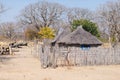 Mud straw and wooden hut with thatched roof in the bush. Local village in the rural Caprivi Strip, the most populated region in Na Royalty Free Stock Photo