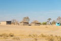 Mud straw and wooden hut with thatched roof in the bush. Local village in the rural Caprivi Strip, the most populated region in Royalty Free Stock Photo