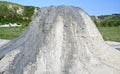 Mud volcano flowing down clayey mud mixed with hydrocarbons. Natural Reserve Salse of Nirano: Modena, Fiorano, Italy