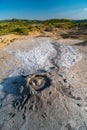 Mud volcano with gas bubble, muddy wet geology, lunar landscape, Berca, Romania Royalty Free Stock Photo