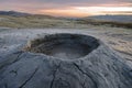 Bubbling mud. Mud volcano at sunset - landmark attraction in Buzau, Romania