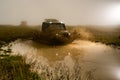 Mud and water splash in off-road racing. Off road car. Beautiful nature. Truck car wheel on offroad steppe adventure Royalty Free Stock Photo