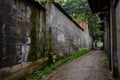 Muddy alleyway between ancient dwelling houses Royalty Free Stock Photo