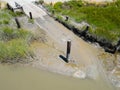 Muddy boat launch ramp, Hudeman Slough, aerial image Royalty Free Stock Photo