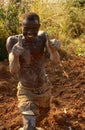 A muddy brick worker in Rwanda.