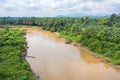 Muddy brown jungle stream meanders through the untouched Rain forest at Bentong, Pahang, Malaysia. Aerial view of a river in the