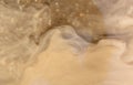 Muddy brown water in a puddle Royalty Free Stock Photo