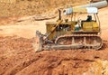 Muddy bulldozer at construction site