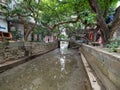Muddy canal in Xiaozhou village, China