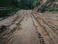 Muddy Dirt road of Uphill climb are barrier made problems of Travel