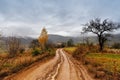 Muddy ground after rain in mountains. Extreme path rural dirt road in the hills Royalty Free Stock Photo