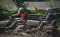 Muddy men in  Lawn Mowers`s race Royalty Free Stock Photo