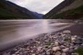 Muddy mountain river with long exposure.