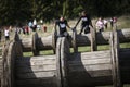 Muddy obstacle race runner in action. Mud run