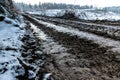 Muddy path of a forest harvester in the winter