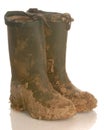 Muddy rubber boots