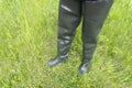 Muddy rubber boots on a white background