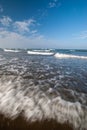 Muddy sand dark brown beach