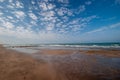 Muddy sand dark brown beach